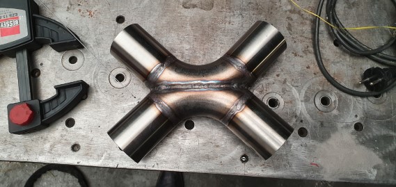Welded X pipe with extension 